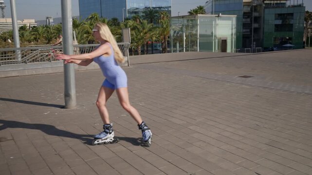 Blonde woman rollerskating outdoors in the city