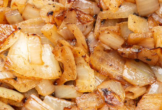 Fried chopped white onions background backdrop. Fried vegetable food concept.