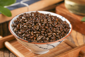 Fototapeta premium Traditional Chinese Bowl of Roasted Coffee Beans on Bamboo Tray - Healthy Hot Beverage Culture