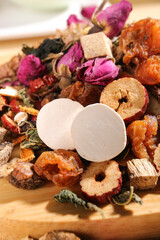 Fototapeta premium Traditional Chinese Tea Ingredients Variety - Dried Herbs Fruits Flowers for Nourishing Herbal Drinks Culture