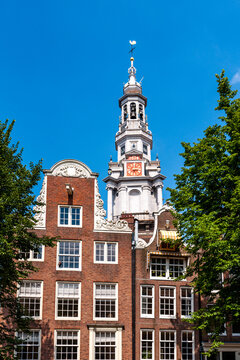 Zuiderkerk tower and brick facades in Amsterdam Centrum