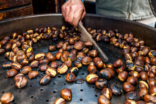Roasting chestnut at a street market in Bellinzona Ticino