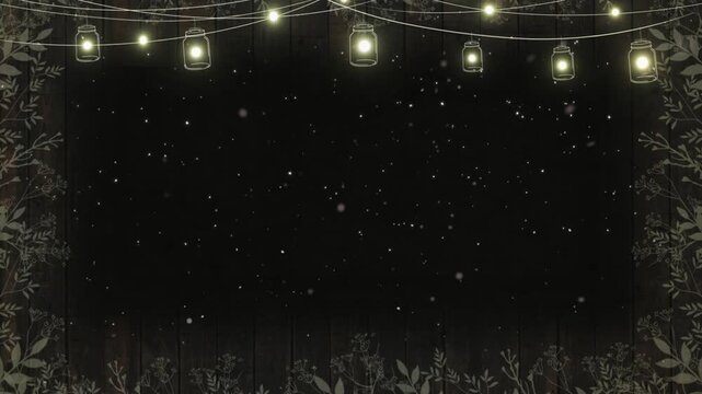 Lanterns hang in a decorative row to illuminate a rustic garden setting at night.