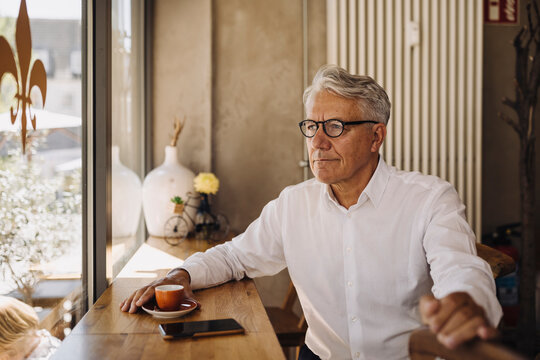 Senior businessman in a cafe