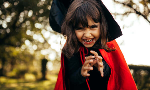 Portrait of little girl masquerade as vampire