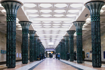 Fototapeta premium Ornate Gafur Gulom metro station interior with massive green ceramic columns in Tashkent Uzbekistan. Monumental Soviet-era underground architecture ideal for travel, urban design content. Editorial.