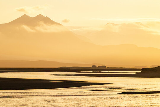 Golden sunset over a winding glacial river in H�fn Iceland