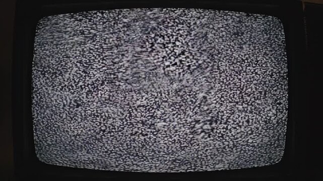 Vintage television screen displaying static and digital glitch effects