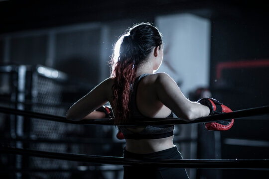 Female boxer in boxing ring