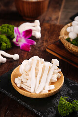 Fresh White Jade Mushrooms from Yunnan in Wooden Bowl - Premium Edible Fungi © QuangVinh