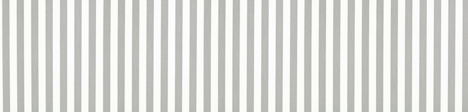 Wide seamless texture of minimalist vertical gray and white stripes on cotton fabric