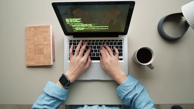 Overhead View Hands Typing Code On Laptop