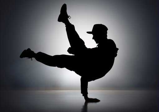 Dynamic silhouette of a young male dancer performing energetic street dance or hip hop moves in a studio against a vibrant neon purple and orange gradient background with floor reflection.