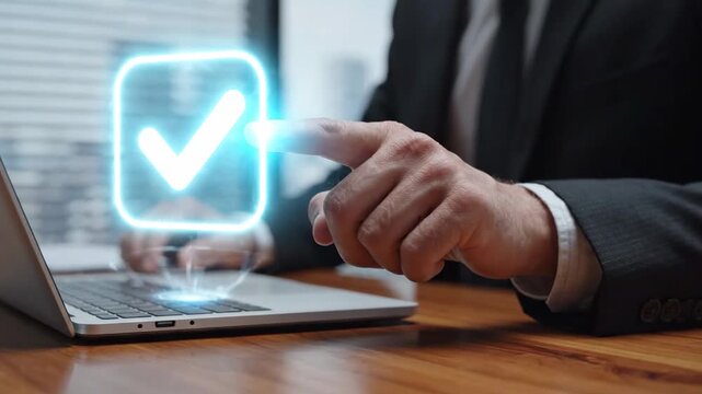 Digital Compliance and Approval: Businessman in suit interacting with glowing checkmark and document icons on a laptop, ideal for corporate technology and quality assurance presentations.