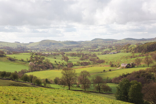 Rolling Green Valley with Stone Farmhouse in the Peak District Spring
