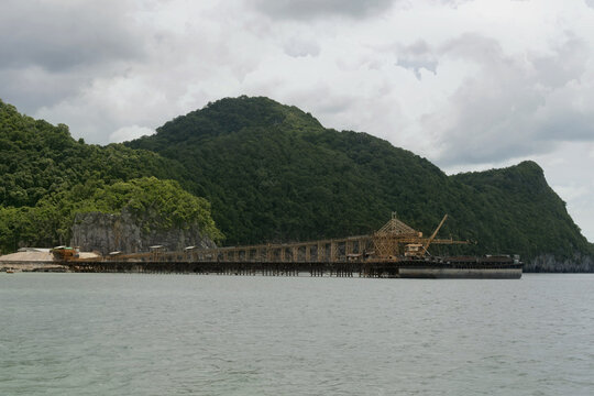 industrial conveyor system with jetty facility along the scenic coast of khanom, thailand