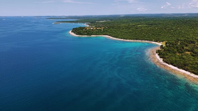 Turquoise and deep blue Adriatic sea water in the Brijuni region, Croatia. Sunny day, aerial perspective