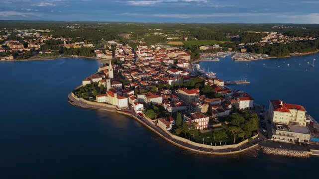 Idyllic view of the ancient town of Porec completely surrounded by the deep blue Adriatic sea, Croatia