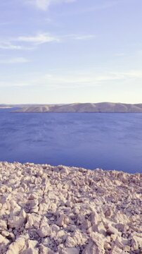 Panning over stone Pag island surrounded with sea
