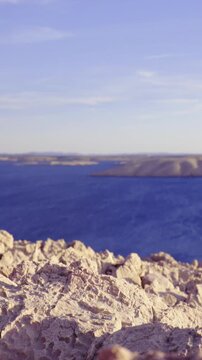 Stone desert and dark blue sea