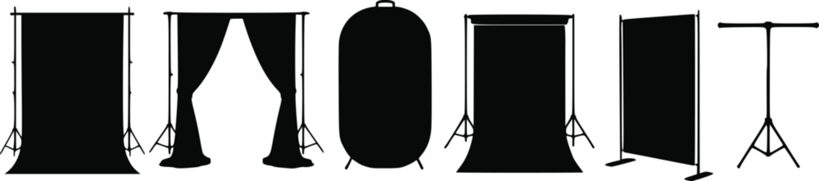 Set of black silhouettes of photography studio backdrops and light stands isolated on white background, Vector