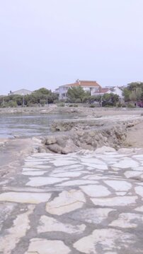 Stone paved beach with calm sea