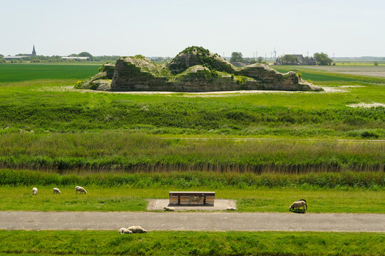 Earth sculpture of a reclining woman in the frisian landscape at the sea dike near Oosterbierum in Friesland The Netherlands