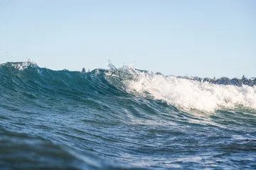 Small breaking wave at the beach. © AlexandraDaryl