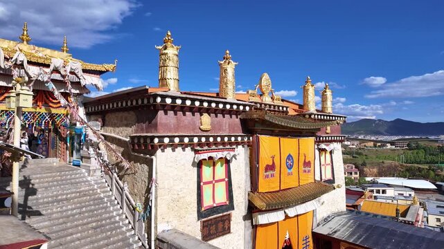 Yunnan, China : Panoramic footage from the prayer hall of the tibetan Buddhism Songzanlin Monastery with the Shangri-La landscape on the Tibetan plateau in the mountains of Yunnan, China