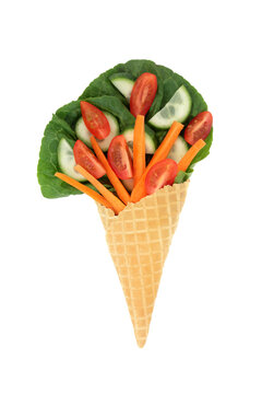 Surreal vegetable ice cream cornet whimsical fun diet concept on white background. Healthy summer organic nutritious food art design.