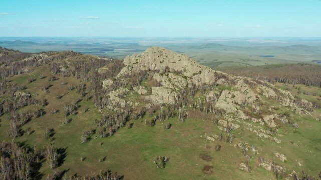 Southern Urals in spring: Yanguziai mountain of the Irendyk ridge. Aerial view.