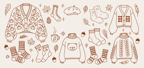 hand drawn cozy autumn essentials, warm winter clothing sketch, seasonal comfort icons, cute sweater weather doodles, stylish cold season attire, trendy autumn fashion set, artistic knitwear elements, © Geetaroy
