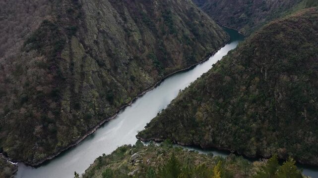 Cinematic drone footage of a river between mountains