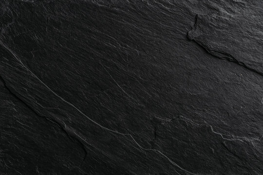 Dark black slate stone background with natural texture