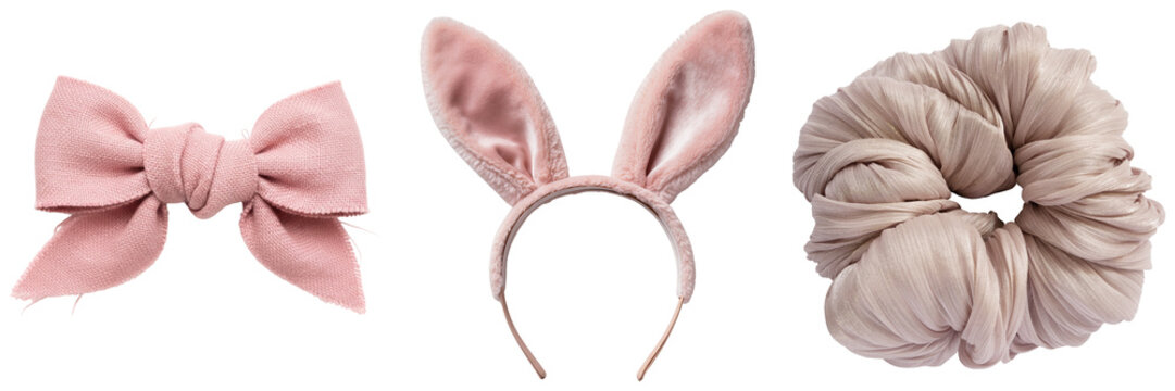 Pink fabric bow, bunny ears headband, and scrunchie isolated on white background