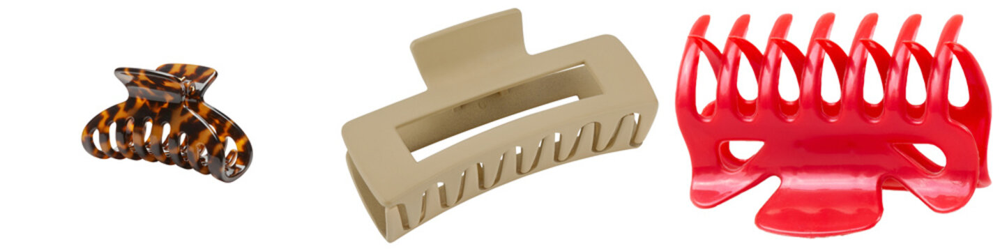 Three different hair claw clips: tortoiseshell, beige, and red, isolated on a white background