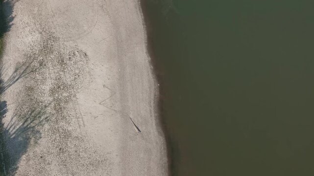 River Po exhibiting severely reduced water levels and exposed riverbeds from an intense summer heatwave and drought. Significantly diminishing the water flow through Lombardy and Emilia Romagna. Italy