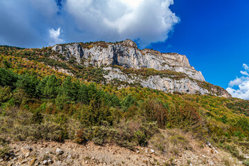 Fototapeta premium Driving through the Valley of Hecho in the Spanish Pyrenees in autumn, Spain