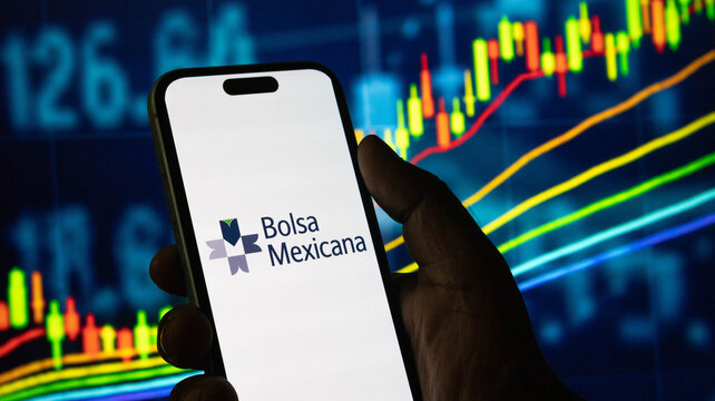 Bolsa mexicana de valores logo on mobile screen with financial stock market backgrounding.
