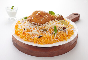 Delhi Style Chicken Biryani, low spicy but too much tasty. Prepared by finest quality basmati rice, chicken meat, cardamoms and other spices. © foody
