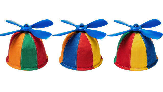 Isolated group of colorful propeller beanies with blue blades, playful headwear for kids