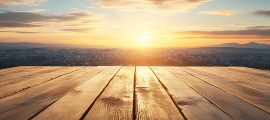 Naklejka premium Rustic brown wooden table surface with a beautiful sunset cityscape background in morning light