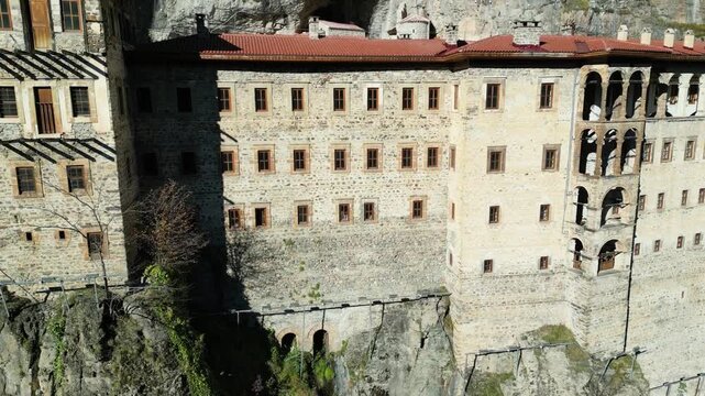Aerial drone view of Sumela Monastery in summer season, historic Greek Orthodox monastery carved into a cliff in Trabzon, Turkey.