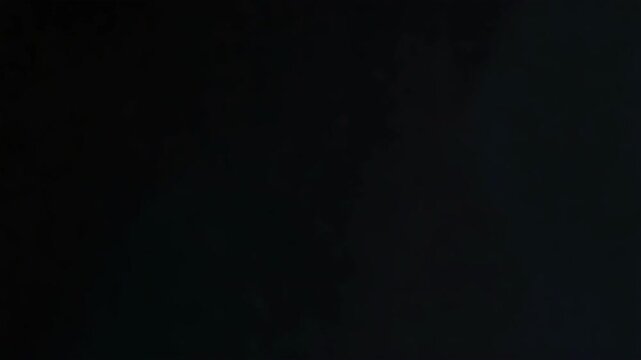 Golden tiger mask on suited figure in dark atmosphere