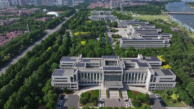 Aerial view of Shouguang municipal government modern buildings surrounded by lush green trees