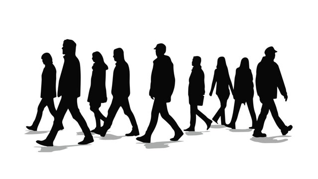 Silhouettes of people walking in a line on a city street at night with dramatic lighting and shadows for urban lifestyle themes