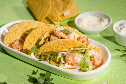 Mexican tacos with shrimp, fresh vegetables and lime
