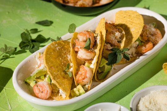 Mexican tacos with shrimp, fresh vegetables and lime