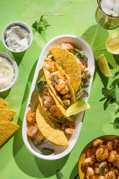 Mexican tacos with shrimp, fresh vegetables and lime