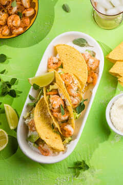 Mexican tacos with shrimp, fresh vegetables and lime